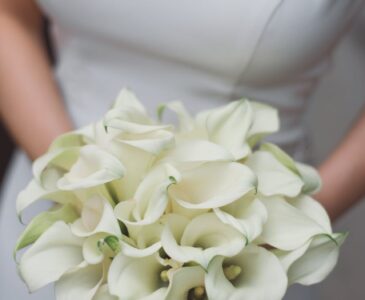 anonymous bride with bouquet of white tender flowers